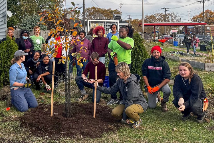 Burten Bell Carr Development, Inc. and HF&G at the East 39th Street Community Garden where they planted fruit trees to mark a new initiative to reforest the Central neighborhood.
